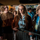 Laurie Strode's granddaughter Allyson (Andi Matichak) holds a gun amid a group of people looking for Halloween villain Michael Myers.